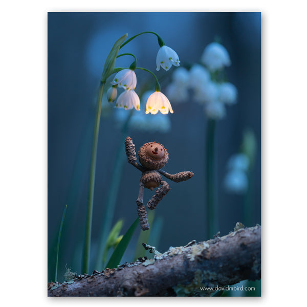 A joyful Becorn jumping off a log towards a cluster of snowdrop flowers. One of the flowers is glowing a warm white color. The background is deep blue.